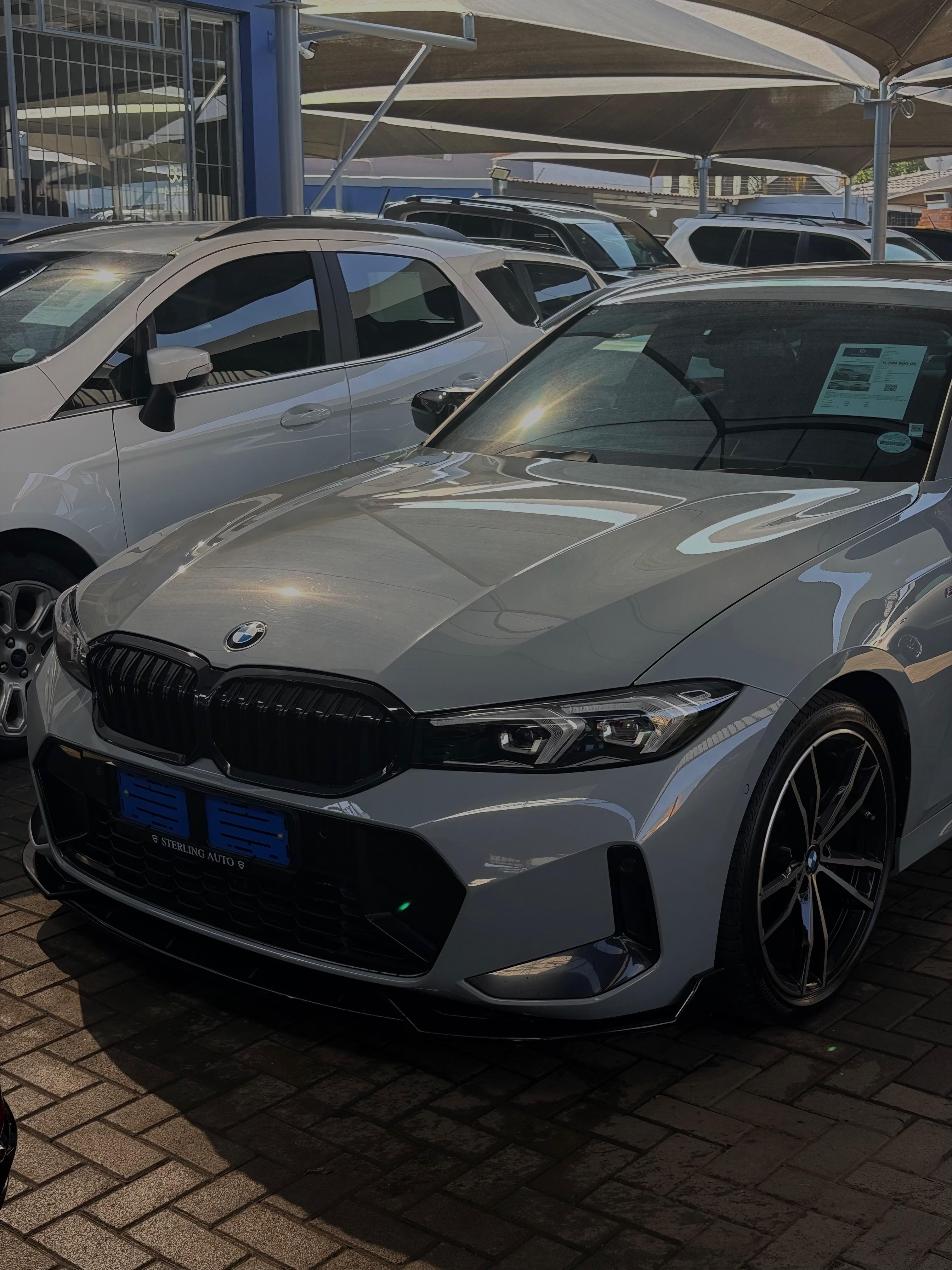 BMW 3 Series photographed on a dealership lot